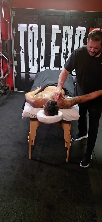 Anthony providing sports-focused massage to a client